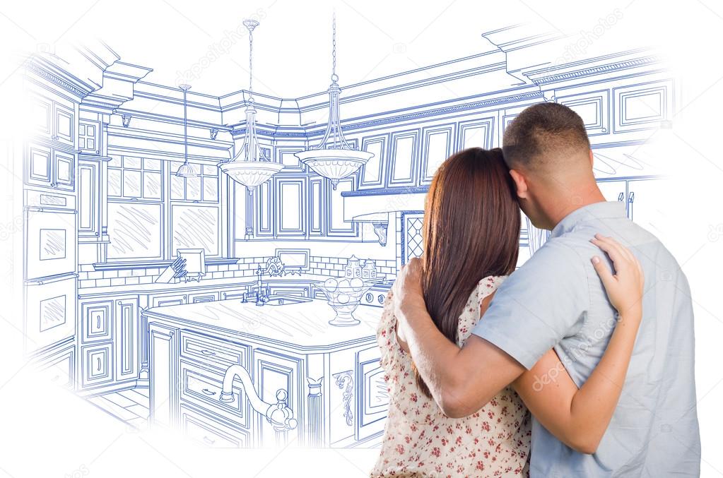 Young Military Couple Looking Over Custom Kitchen Design Drawing