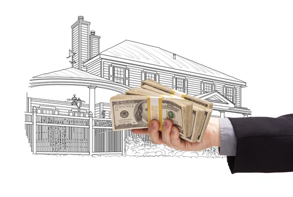 Hand Holding Thousands In Cash Over House Drawing — Stock Photo, Image