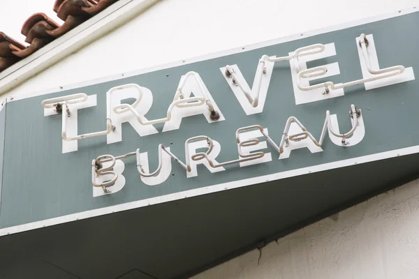 Neon Travel Bureau Sign on Costruzione — Foto Stock