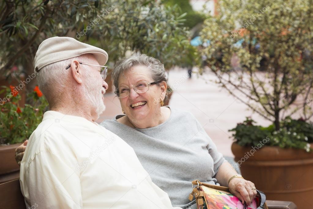 Senior Couple on Bench in the Market Place