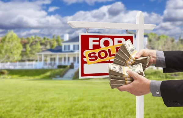 Man Handing Over Money in Front Sold House and Sign — Stock Photo, Image