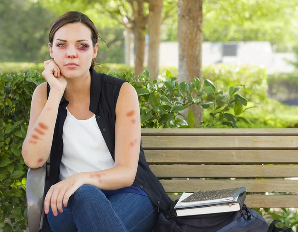 Depressed Bruised and Battered Young Woman on Bench — Stock Photo, Image