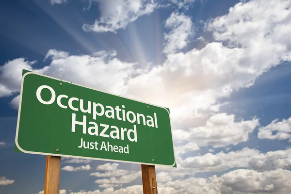 Occupational Hazard Green Road Sign Over Clouds — Stock Photo, Image