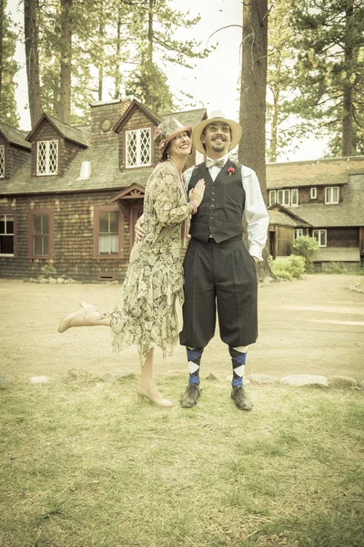 1920s Dressed Romantic Couple in Front of Old Cabin — Stock Photo, Image