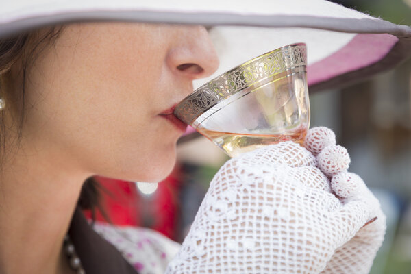 1920s Dressed Girl with Hat, Gloves and Glass of Wine