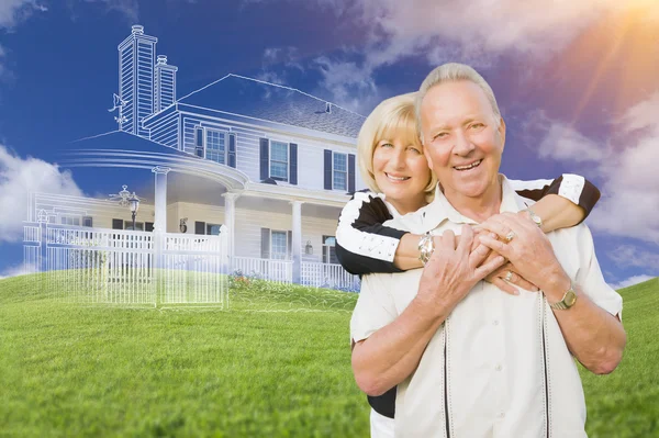 Senior Couple In Front of Ghosted House Drawing on Grass — Stock Photo, Image