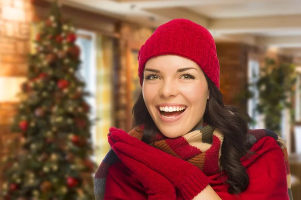 Mixed Race Woman Wearing Mittens and Hat In Christmas Setting — Stock Photo, Image
