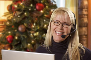 Woman with Phone Headset In Front of Christmas Tree, Computer clipart