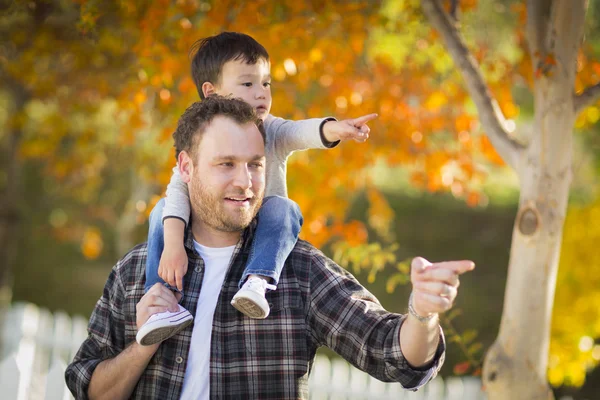 Mixed Race Boy Riding Piggyback on Shoulders of Caucasian Father — Stock Photo, Image