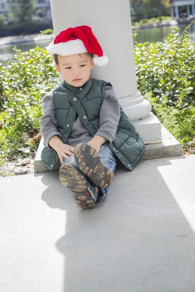 Melancholy Mixed Race Boy Wearing Christmas Santa Hat — Stock Photo, Image