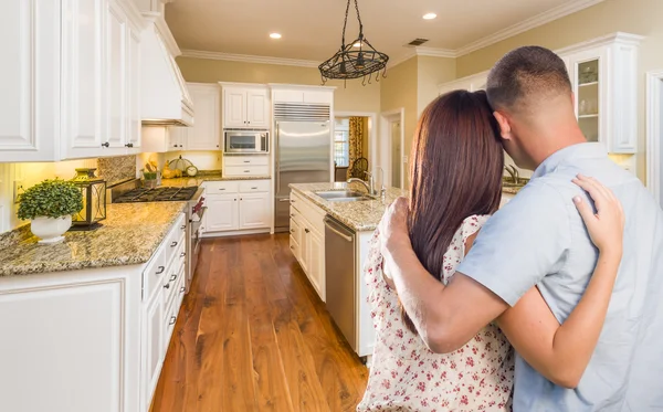 Young Hopeful Military Couple Looking At Custom Kitchen — Stock Photo, Image