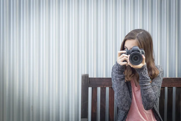 Girl Photographer Sitting and Pointing Camera — Stock Photo, Image