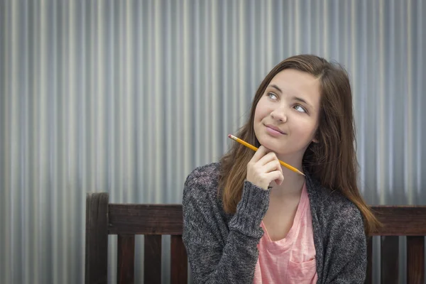 Young Daydreaming Female Student With Pencil Looking to the Side — Stock Photo, Image