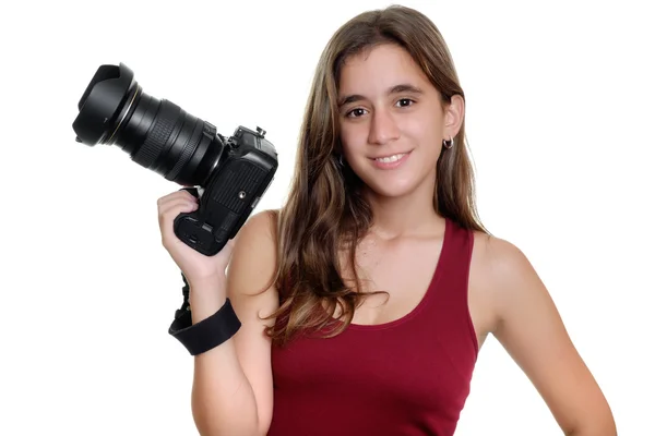 Teenage girl holding a professional camera — Stock Photo, Image