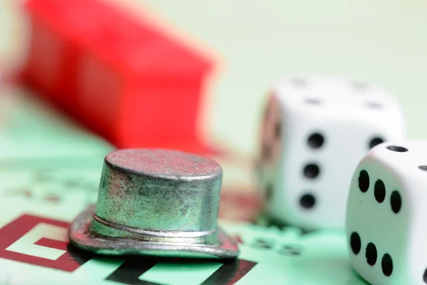 Monopoly game with tokens and dice — Stock Photo, Image