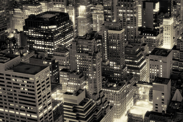 Aerial view of New York City buildings illuminated at night