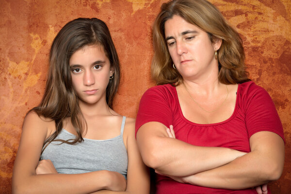 Angry teenage girl and her worried mother