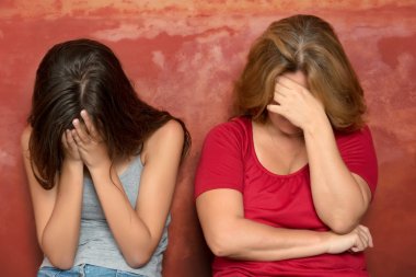 Teenage girl and her mother crying clipart