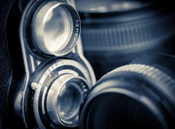 Vintage twin reflex camera and lenses — Stock Photo, Image