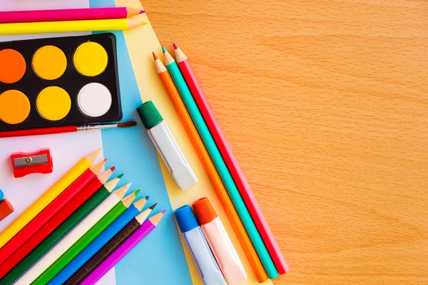 Colorful art supplies on a school desk — Stock Photo, Image