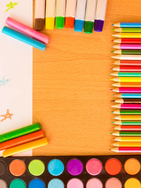 Colorful art supplies on a school desk — Stock Photo, Image