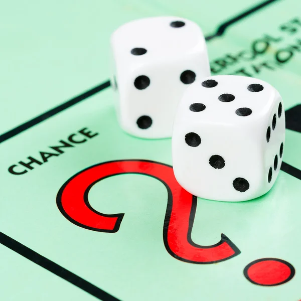 Dice next to the CHANCE space in a Monopoly game — Stock Photo, Image