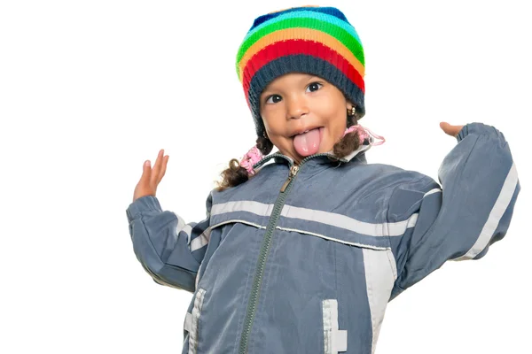 Small mixed race girl doing a funny gesture — Stock Photo, Image