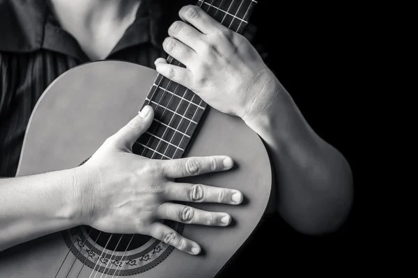 Hands holding a classic guitar — Stock Photo, Image