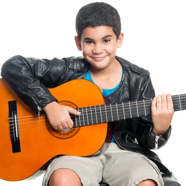 Hispanic boy playing an acoustic guitar — Stock Photo, Image