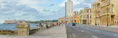 The Malecon in Havana with people and traffic