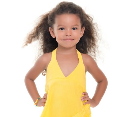 Small hispanic girl wearing a yellow summer dress
