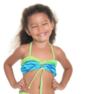 Cute small hispanic girl wearing a swimsuit