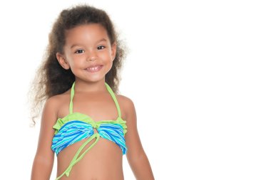Cute small hispanic girl wearing a swimsuit