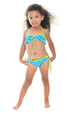 Cute small hispanic girl wearing a swimsuit