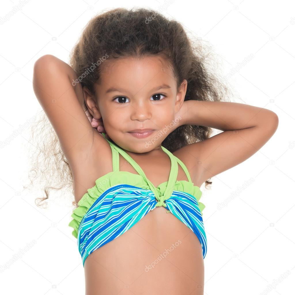 Cute small hispanic girl wearing a swimsuit
