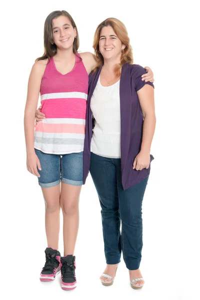 Hispanic teenage girl hugging her mother isolated on white — Stock Photo, Image