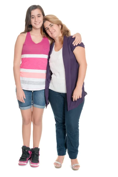 Hispanic teenage girl hugs her mother isolated on white — Stock Photo, Image