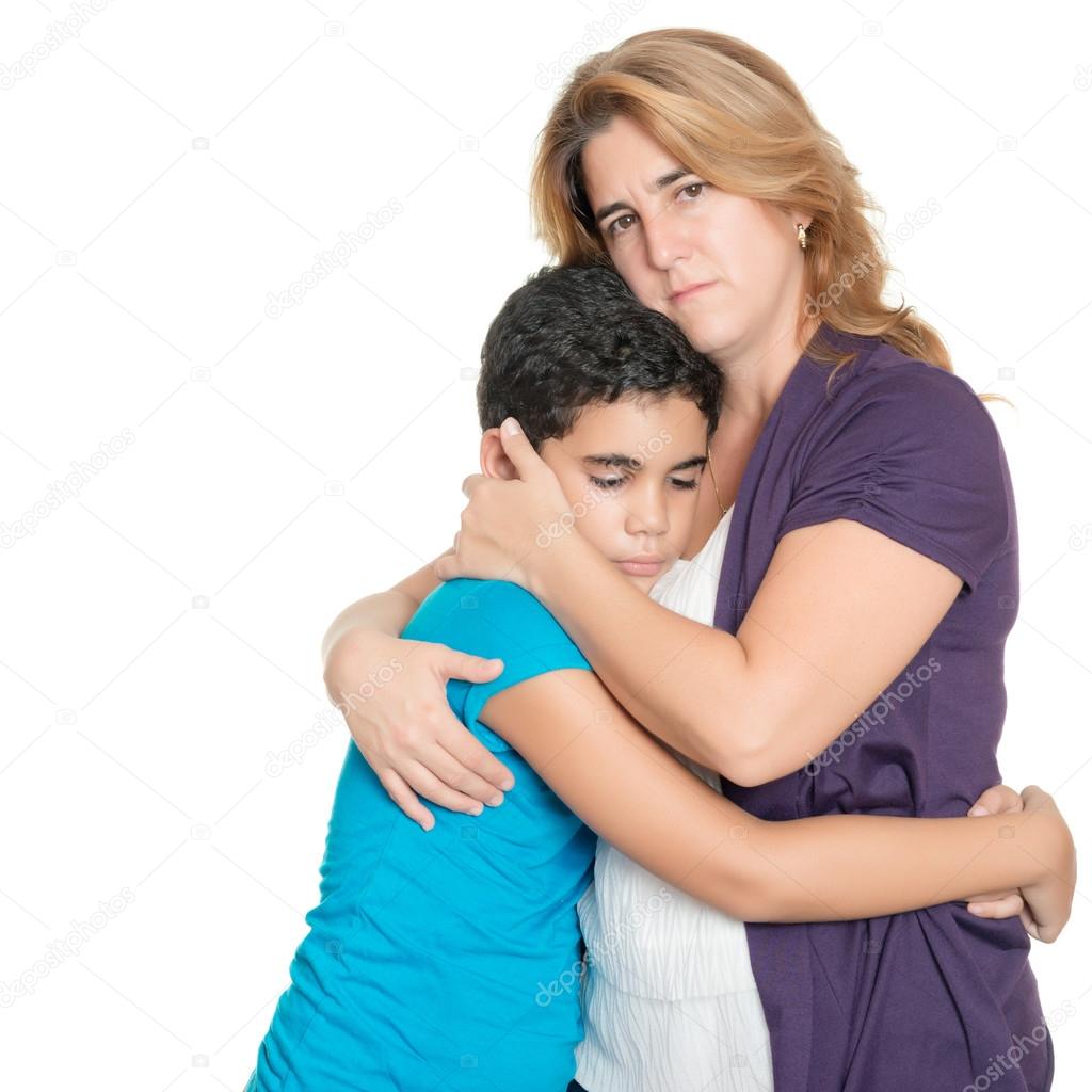 Sad mother hugging her son isolated on white