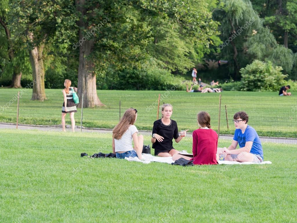 Young friends camping at the Great Lawn at Central Park in Manh Stock Editorial Photo