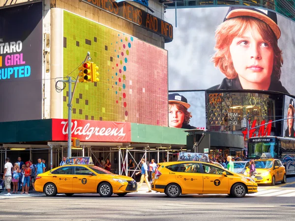 Yellow cabs and colorful billboards at Times Square in New York City — 스톡 사진