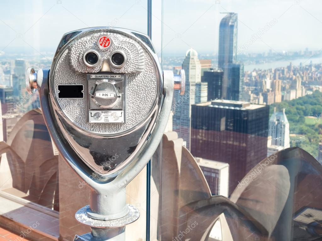 Binoculars looking at skyscrapers from an observation deck in Ne