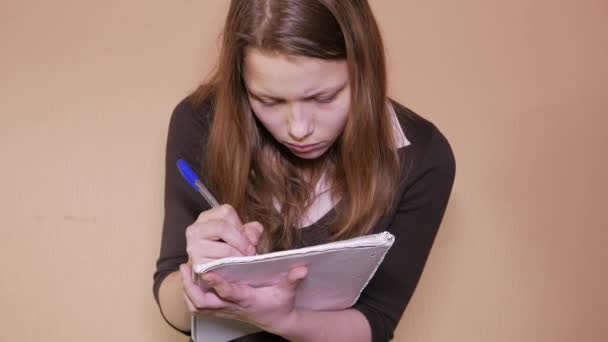 Close-up of an exhausted young woman working or preparing for her exam — Stock Footage Close-up of an exhausted young woman working or preparing for her exam Royalty Free Stock Footage