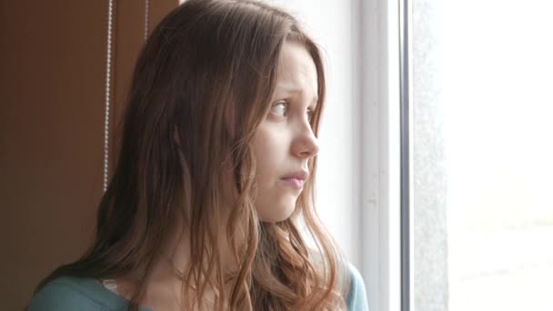 Depressed girl at home. Sad girl near window. 4K UHD. — Stock Footage Depressed girl at home. Sad girl near window. 4K UHD. Stock Footage