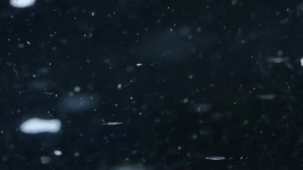 Macro gros plan d'un élément dans l'eau ou l'huile, fond abstrait. 4K UHD .