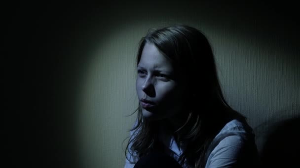 Scared teen girl in a dark. 4K UHD. — Stock Video