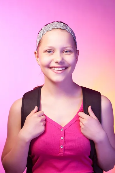 Teen girl goes to school with a backpack on her back — Stock Photo, Image