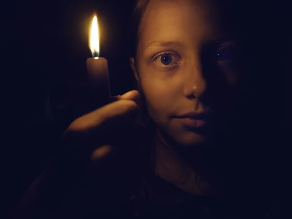 Teen girl with a candle — Stock Photo, Image