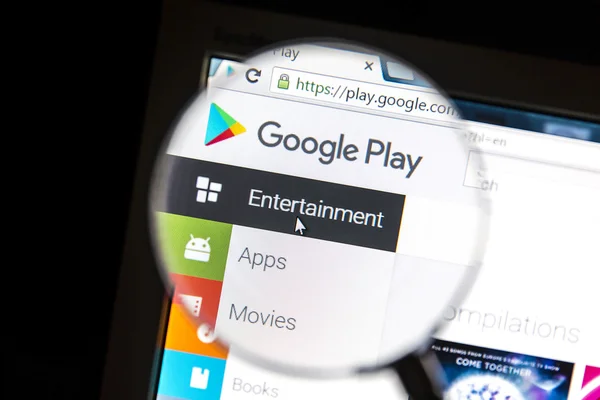 Google Play's website under a magnifying glass — Stock Photo, Image
