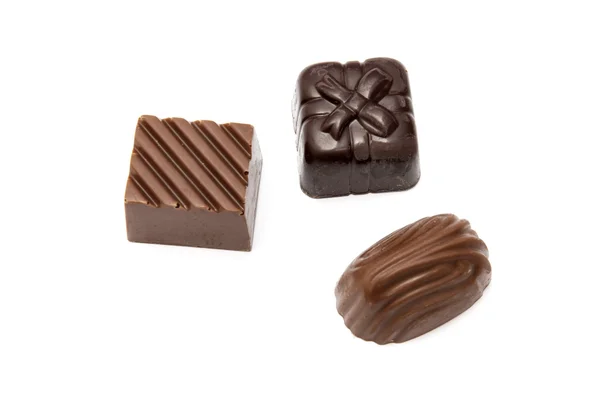 Chocolates primer plano sobre fondo blanco — Foto de Stock