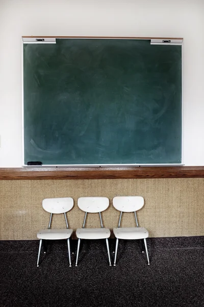 Chalkboard with Charis in Classroom — Stock Photo, Image